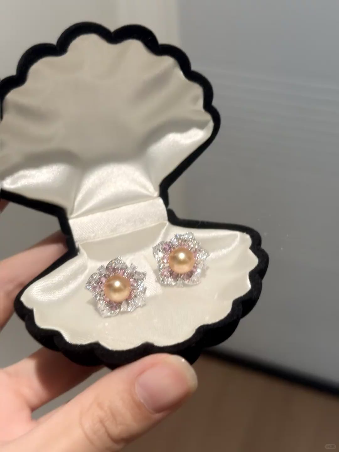 Video view of golden flower stud high-lustre freshwater pearl earrings styled for wedding guest looks