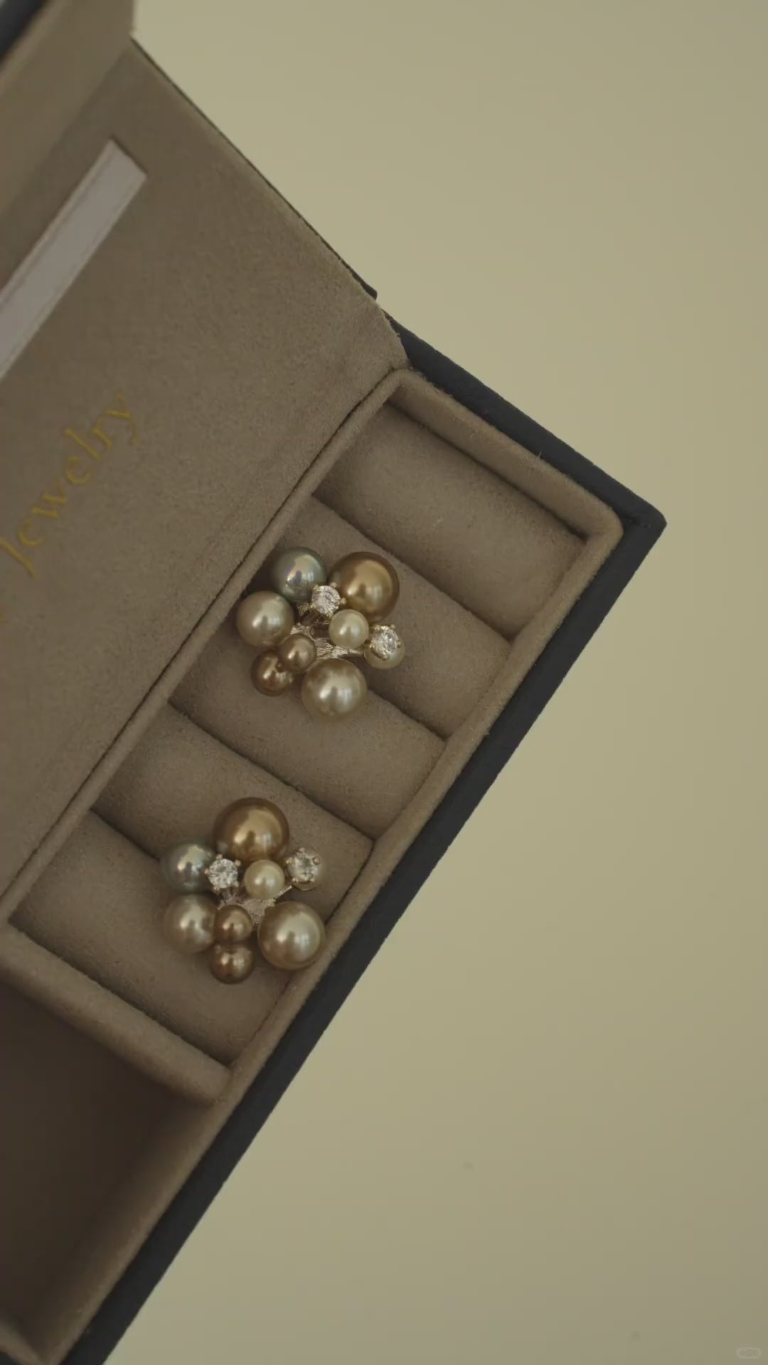 Video view of pearl cluster stud high-lustre freshwater pearl earrings styled for wedding guest looks