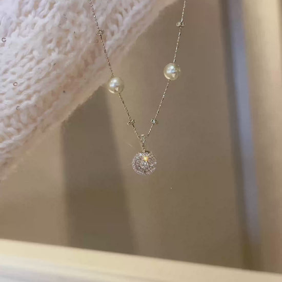 Video view of compass pendant high-lustre freshwater pearl necklace styled for weddings
