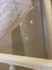 Video view of compass pendant high-lustre freshwater pearl necklace styled for weddings