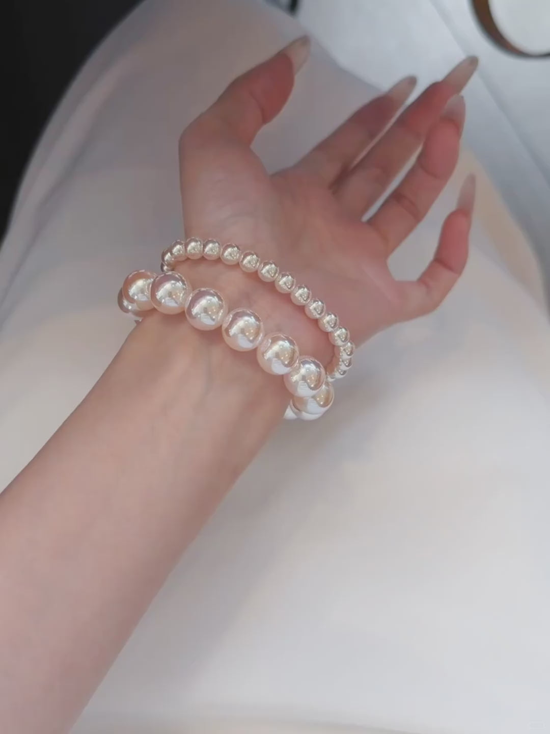 Video view of pink pearl high-lustre freshwater pearl bracelet styled for bridal styling