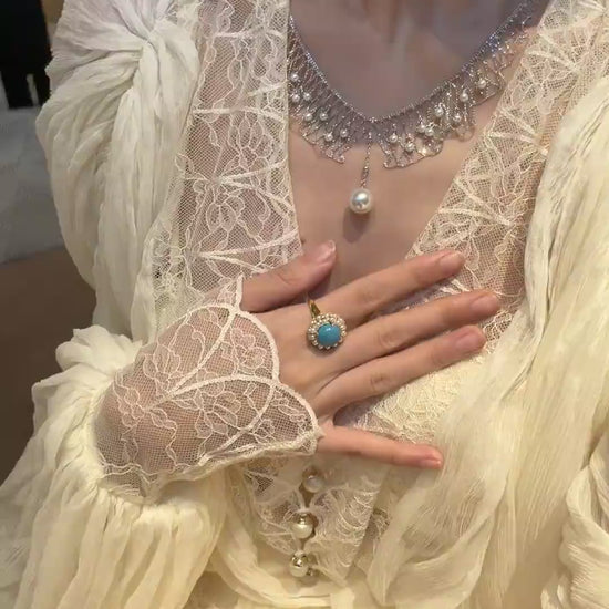 Video view of dreamcatcher high-lustre freshwater pearl necklace styled for weddings