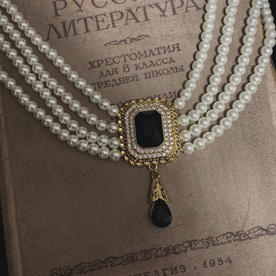 Video view of vintage cameo high-lustre freshwater pearl necklace styled for weddings