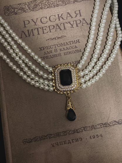 Video view of vintage cameo high-lustre freshwater pearl necklace styled for weddings
