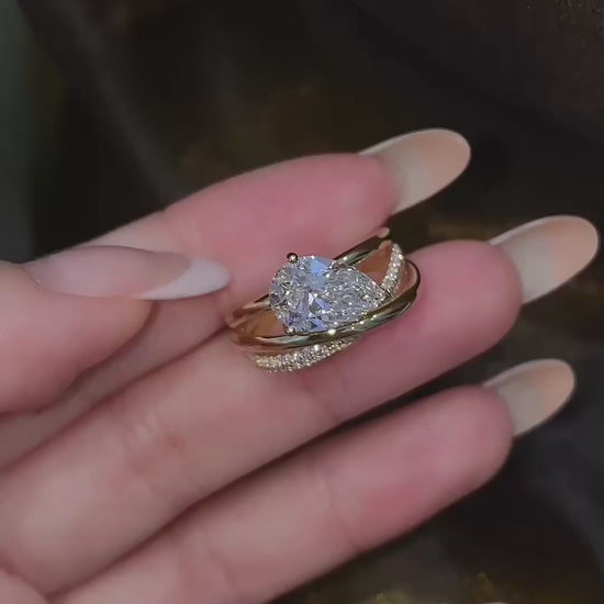 Video of lab-grown diamond pear stacking engagement ring for stylish proposals