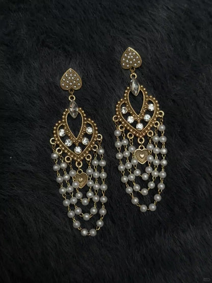 Video view of chandelier high-lustre freshwater pearl earrings styled for wedding guest looks