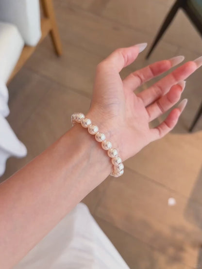 Video view of blush strand high-lustre freshwater pearl bracelet styled for bridal styling