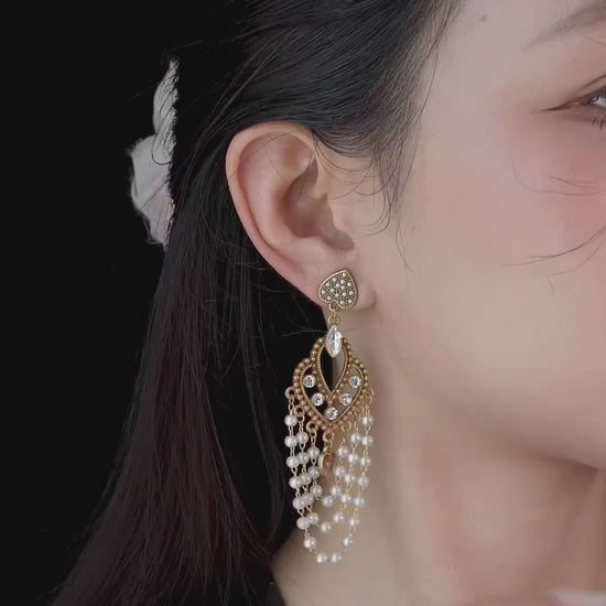 Video view of chandelier high-lustre freshwater pearl earrings styled for wedding guest looks