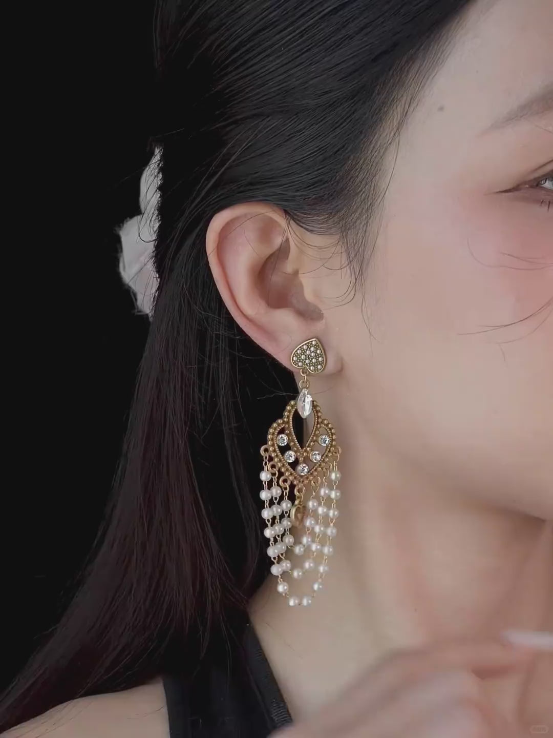 Video view of chandelier high-lustre freshwater pearl earrings styled for wedding guest looks