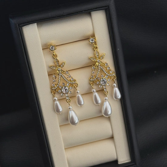Video view of court statement high-lustre freshwater pearl earrings styled for wedding guest looks
