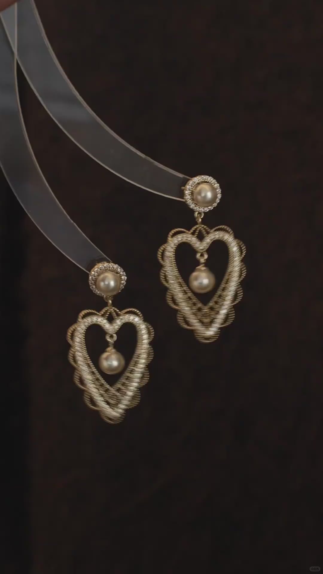 Video view of lace heart high-lustre freshwater pearl earrings styled for wedding guest looks