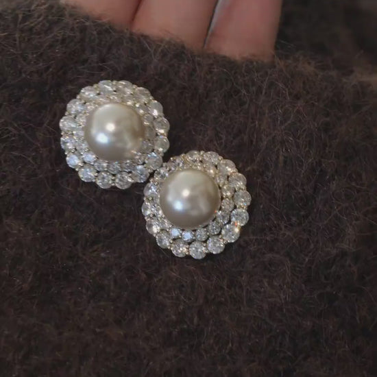 Video view of halo stud high-lustre freshwater pearl earrings styled for wedding guest looks