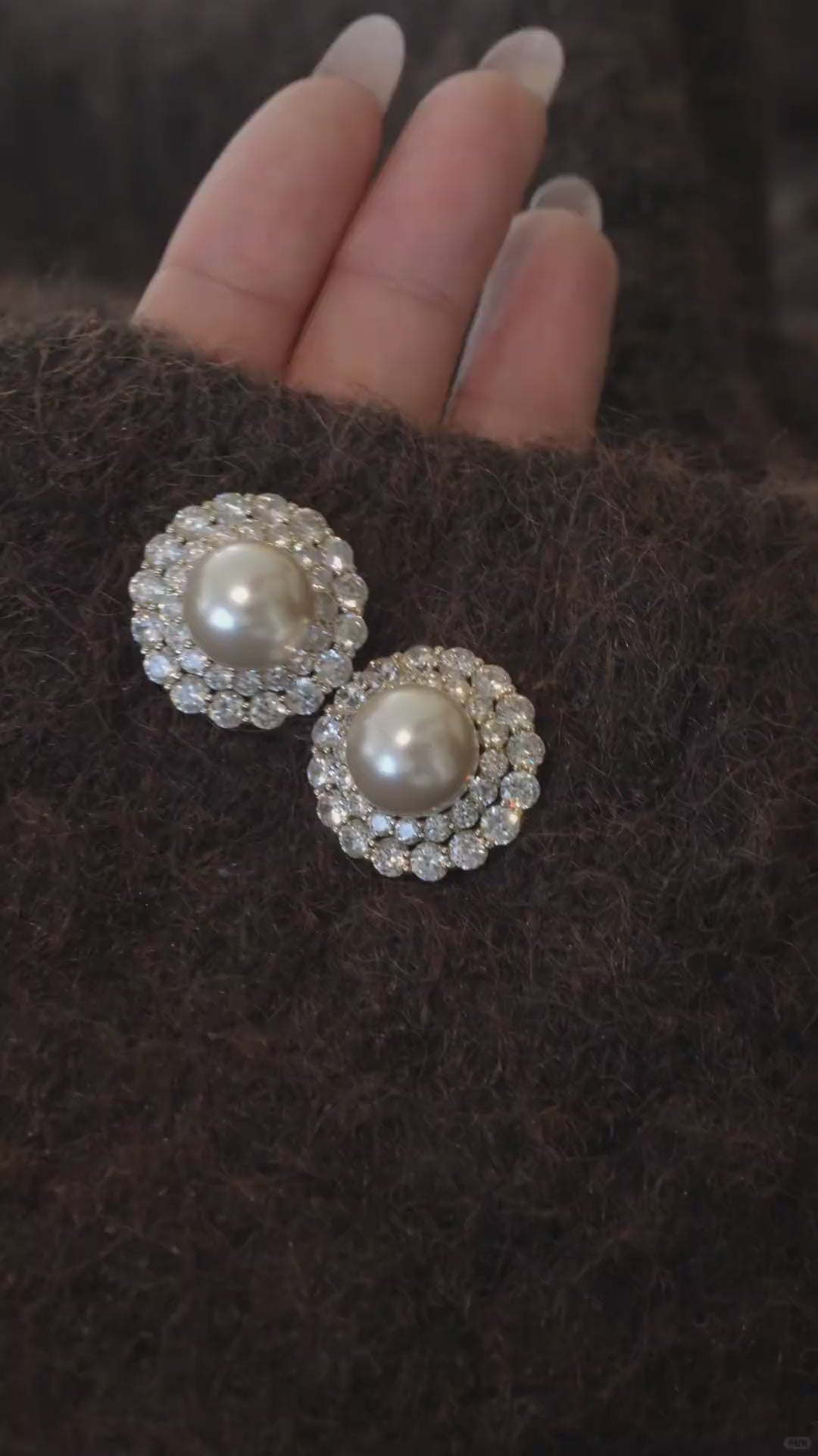 Video view of halo stud high-lustre freshwater pearl earrings styled for wedding guest looks