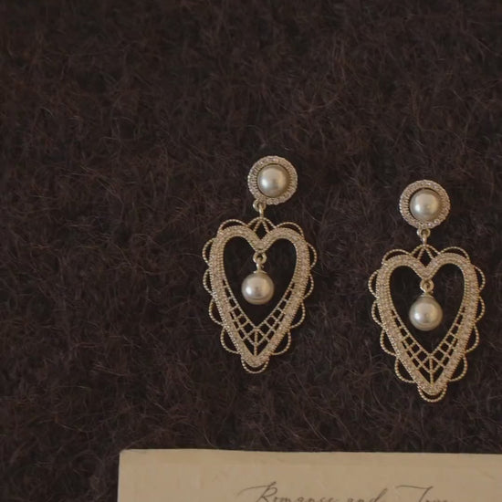 Video view of lace heart high-lustre freshwater pearl earrings styled for wedding guest looks