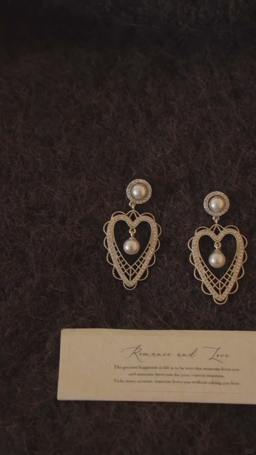 Video view of lace heart high-lustre freshwater pearl earrings styled for wedding guest looks