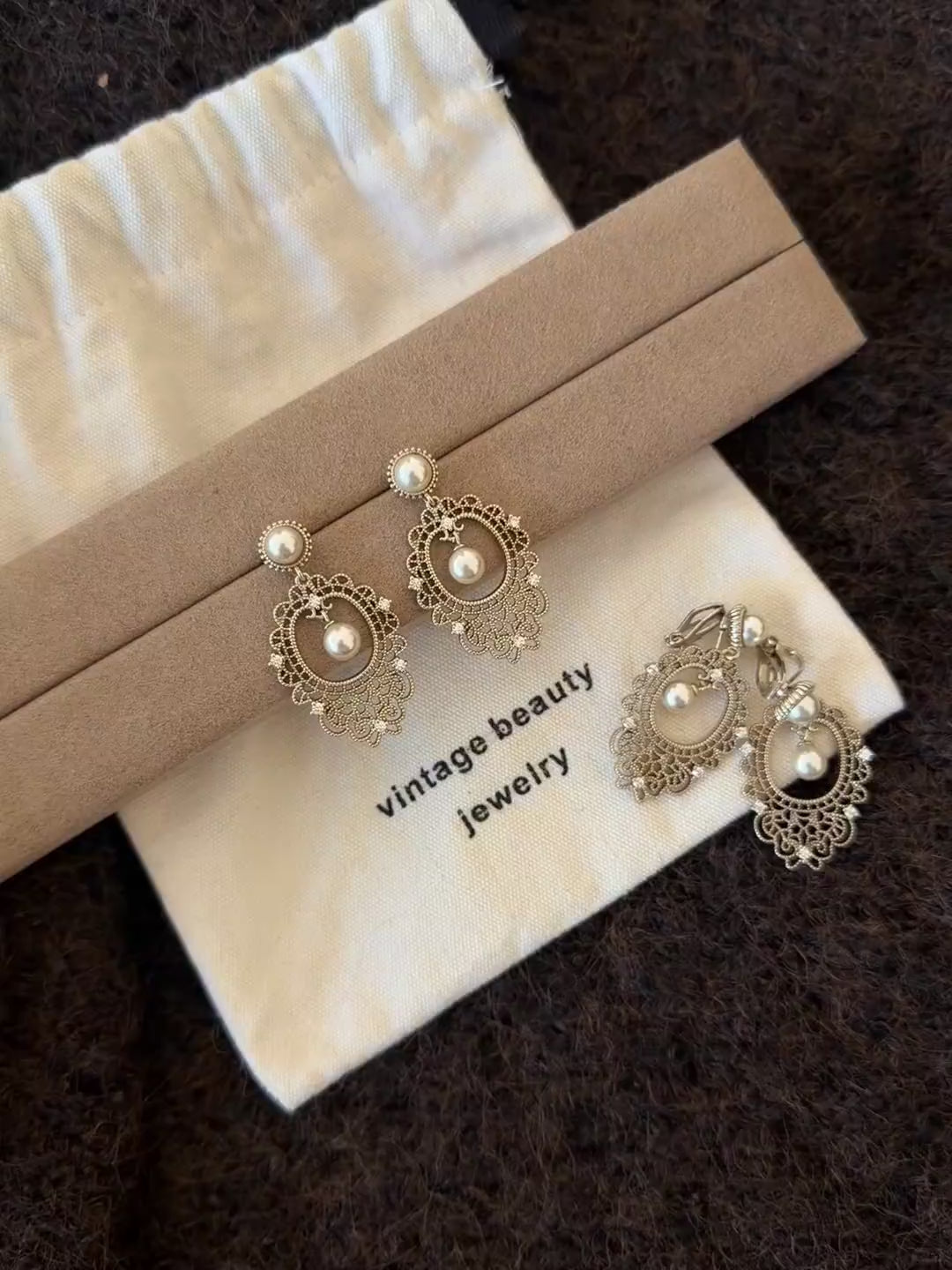 Video view of lace drop high-lustre freshwater pearl earrings styled for wedding guest looks