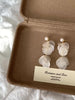 Video view of white shell drop high-lustre freshwater pearl earrings styled for wedding guest looks