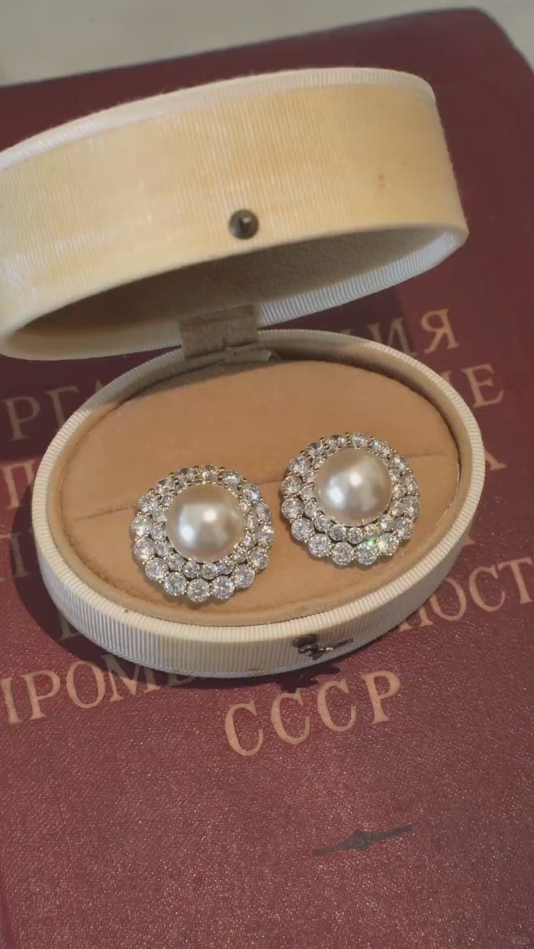 Video view of halo stud high-lustre freshwater pearl earrings styled for wedding guest looks