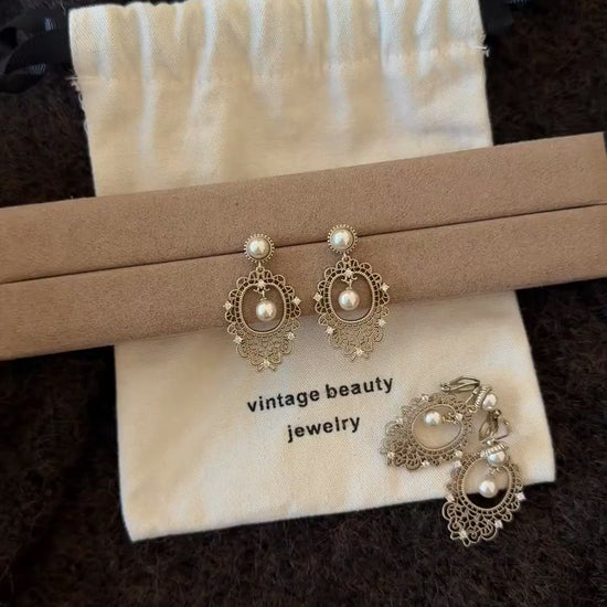 Video view of lace drop high-lustre freshwater pearl earrings styled for wedding guest looks