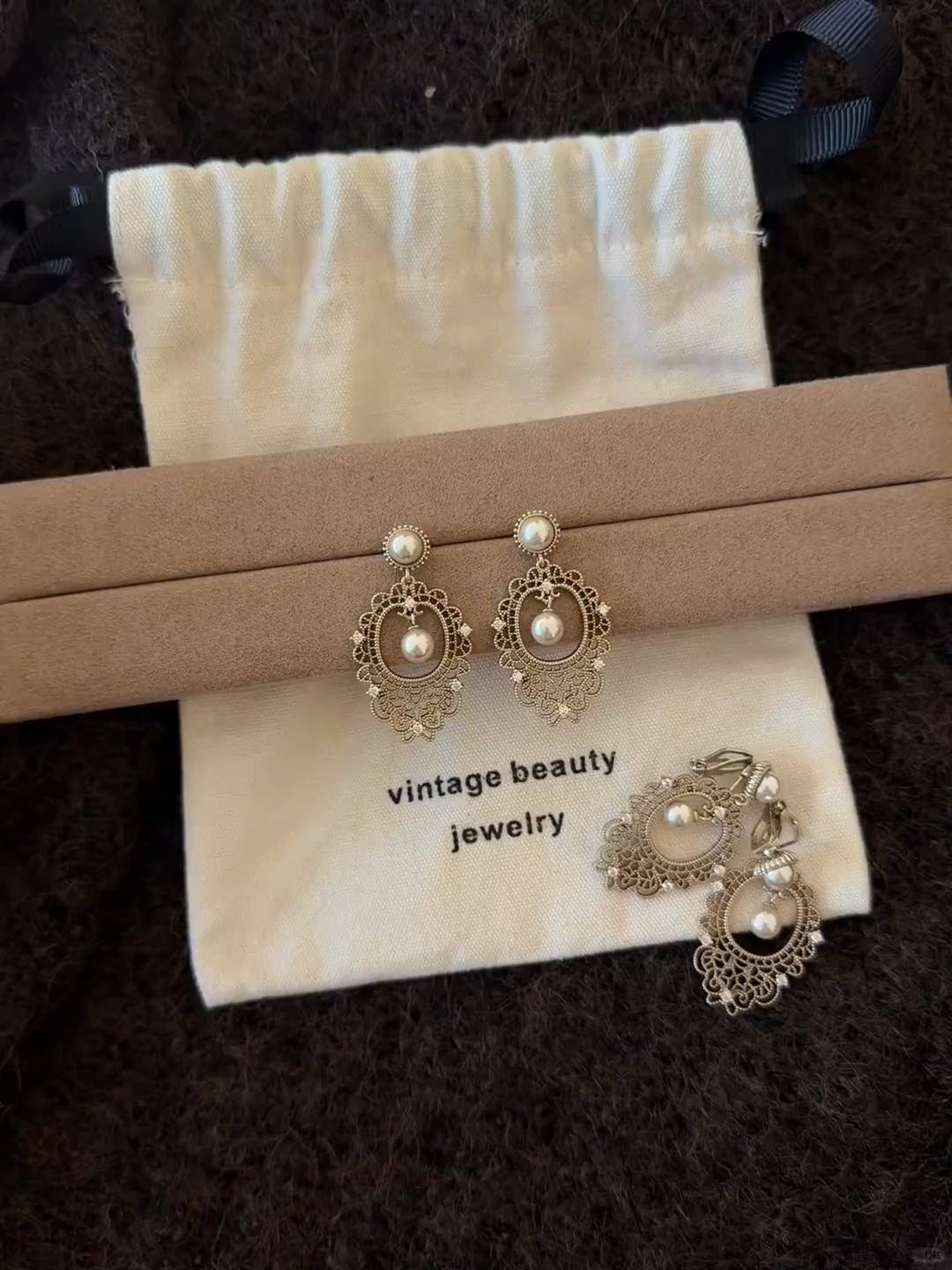 Video view of lace drop high-lustre freshwater pearl earrings styled for wedding guest looks