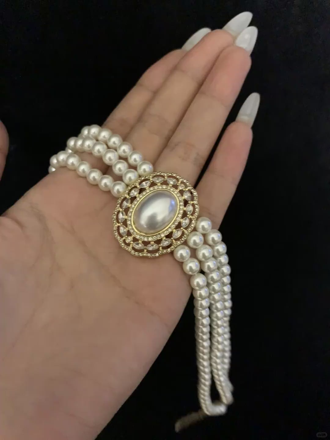 Video view of multi-strand high-lustre freshwater pearl bracelet styled for bridal styling