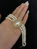 Video view of multi-strand high-lustre freshwater pearl bracelet styled for bridal styling
