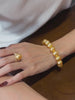 Video view of golden strand high-lustre freshwater pearl bracelet styled for bridal styling