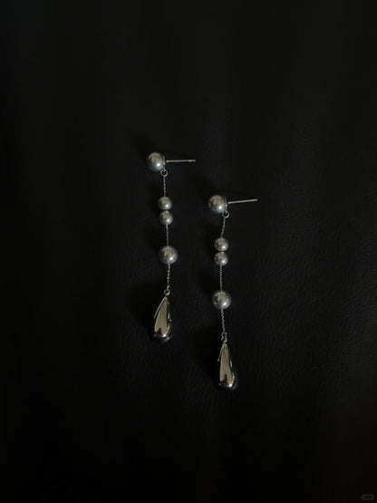 Video view of silver-tone drop high-lustre freshwater pearl earrings styled for wedding guest looks