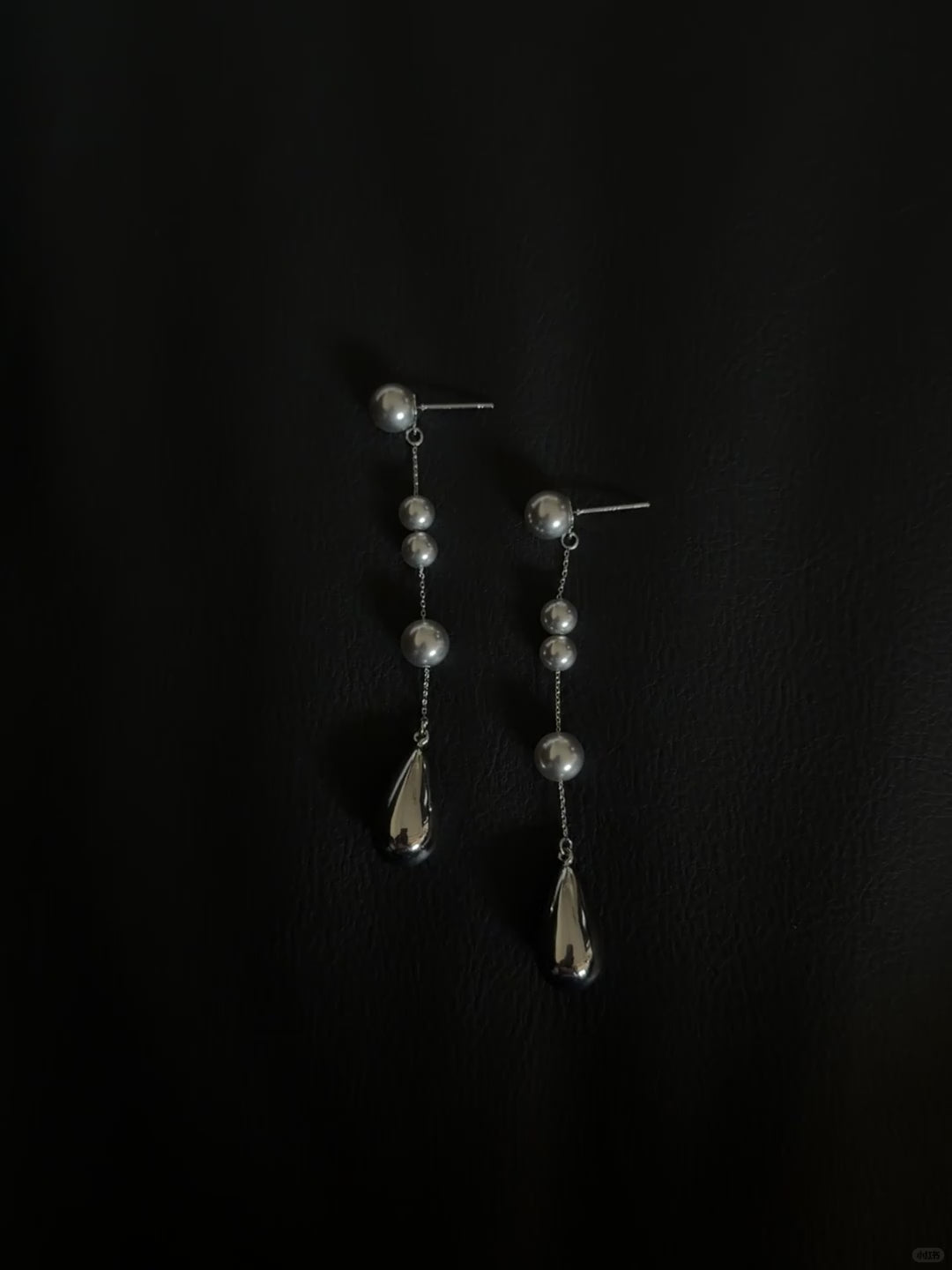 Video view of silver-tone drop high-lustre freshwater pearl earrings styled for wedding guest looks