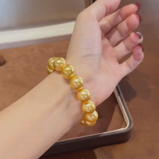 Video view of golden pearl high-lustre freshwater pearl bracelet styled for bridal styling
