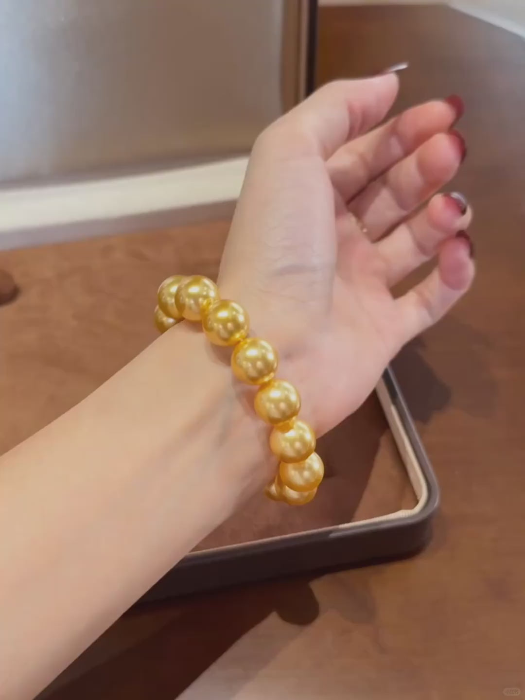 Video view of golden pearl high-lustre freshwater pearl bracelet styled for bridal styling