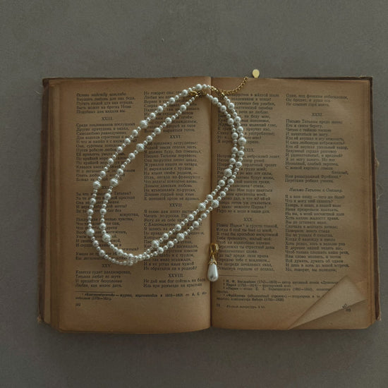 Video view of poetic pendant high-lustre freshwater pearl necklace styled for weddings