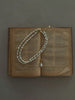 Video view of poetic pendant high-lustre freshwater pearl necklace styled for weddings