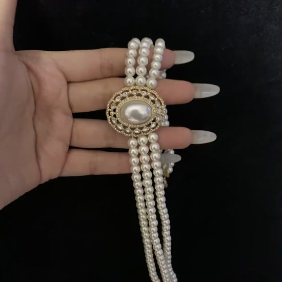 Video view of multi-strand high-lustre freshwater pearl bracelet styled for bridal styling