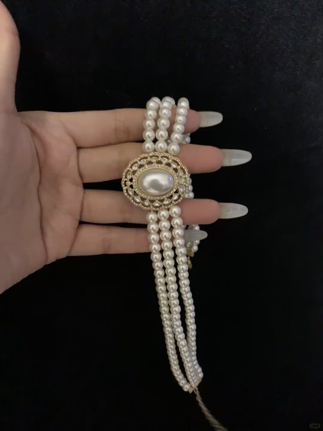 Video view of multi-strand high-lustre freshwater pearl bracelet styled for bridal styling