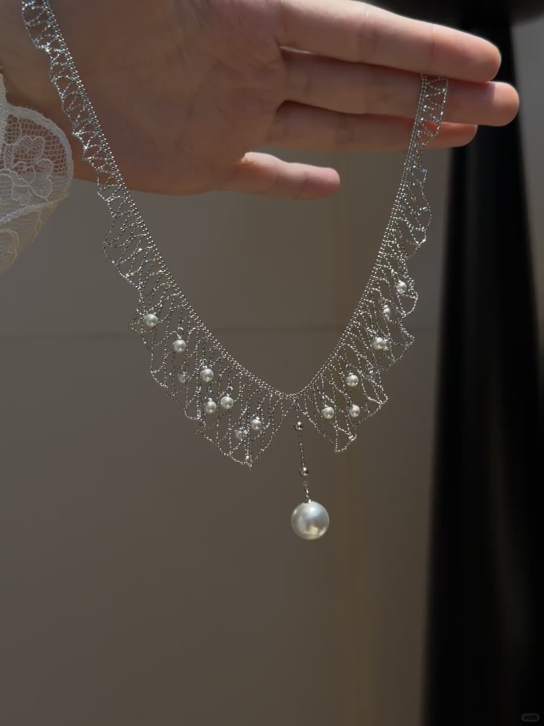 Video view of dreamcatcher high-lustre freshwater pearl necklace styled for weddings