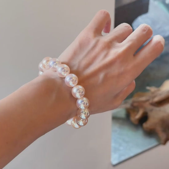 Video view of blush strand high-lustre freshwater pearl bracelet styled for bridal styling