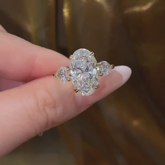 Video of lab-grown diamond oval three stone engagement ring for engagement proposals