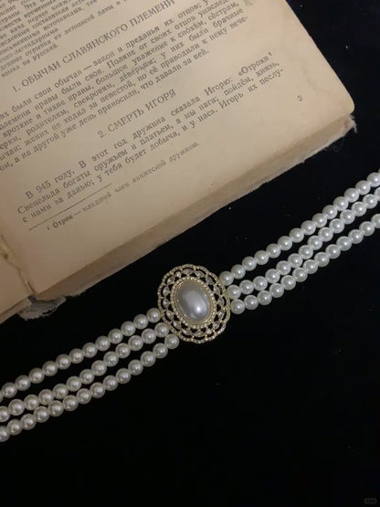 Video view of multi-strand high-lustre freshwater pearl bracelet styled for bridal styling