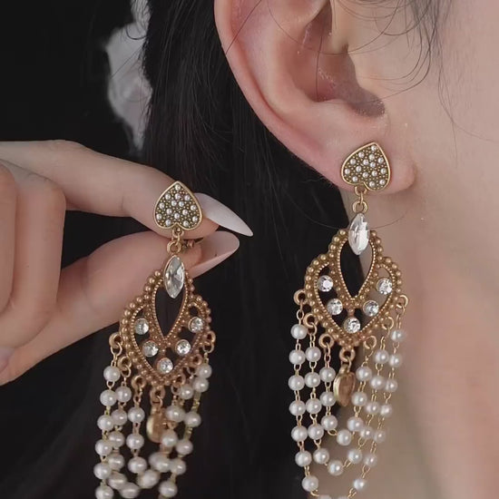 Video view of chandelier high-lustre freshwater pearl earrings styled for wedding guest looks