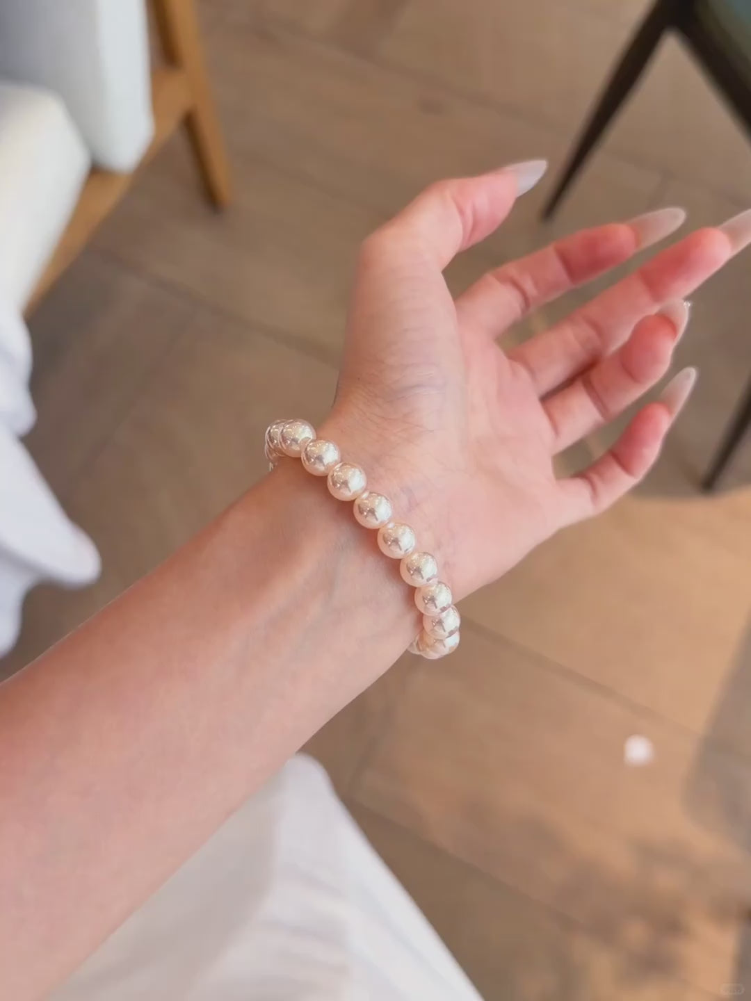 Video view of blush strand high-lustre freshwater pearl bracelet styled for bridal styling