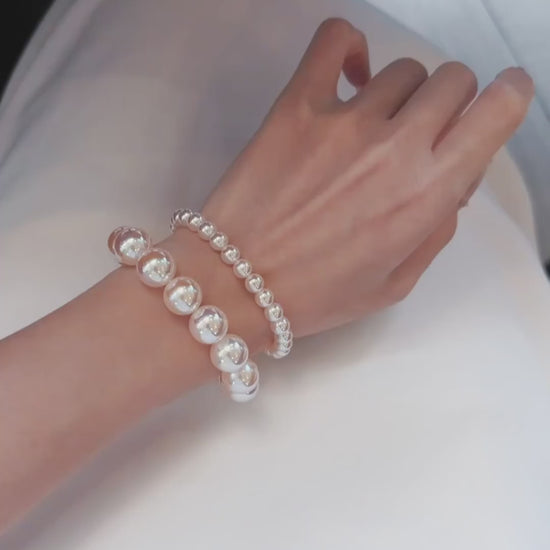 Video view of pink pearl high-lustre freshwater pearl bracelet styled for bridal styling