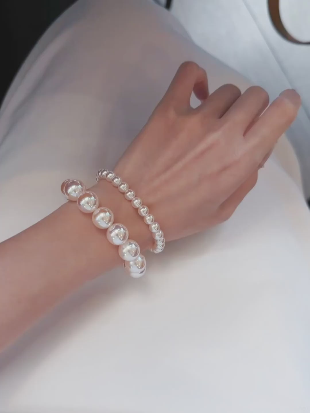 Video view of pink pearl high-lustre freshwater pearl bracelet styled for bridal styling