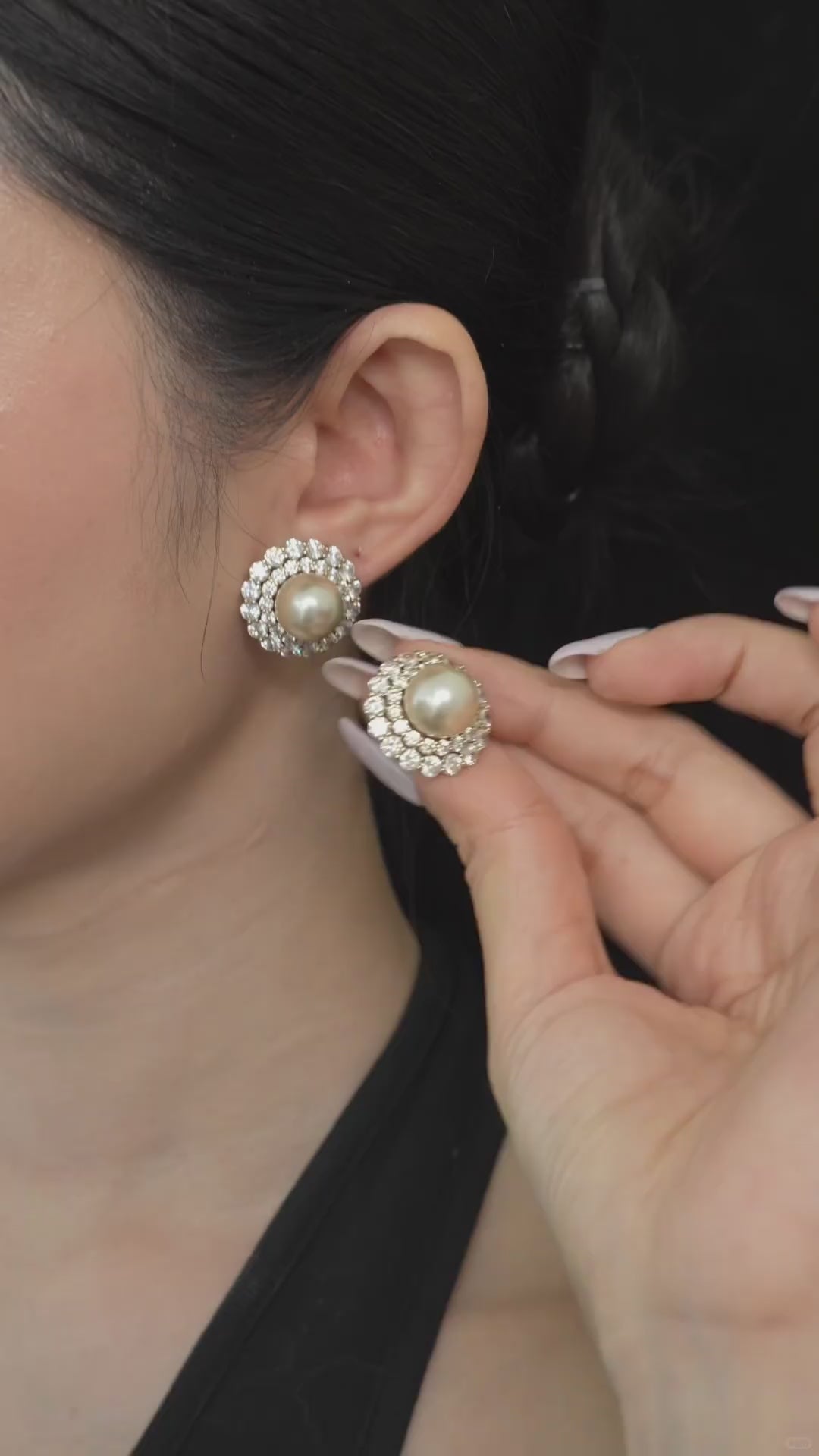 Video view of halo stud high-lustre freshwater pearl earrings styled for wedding guest looks