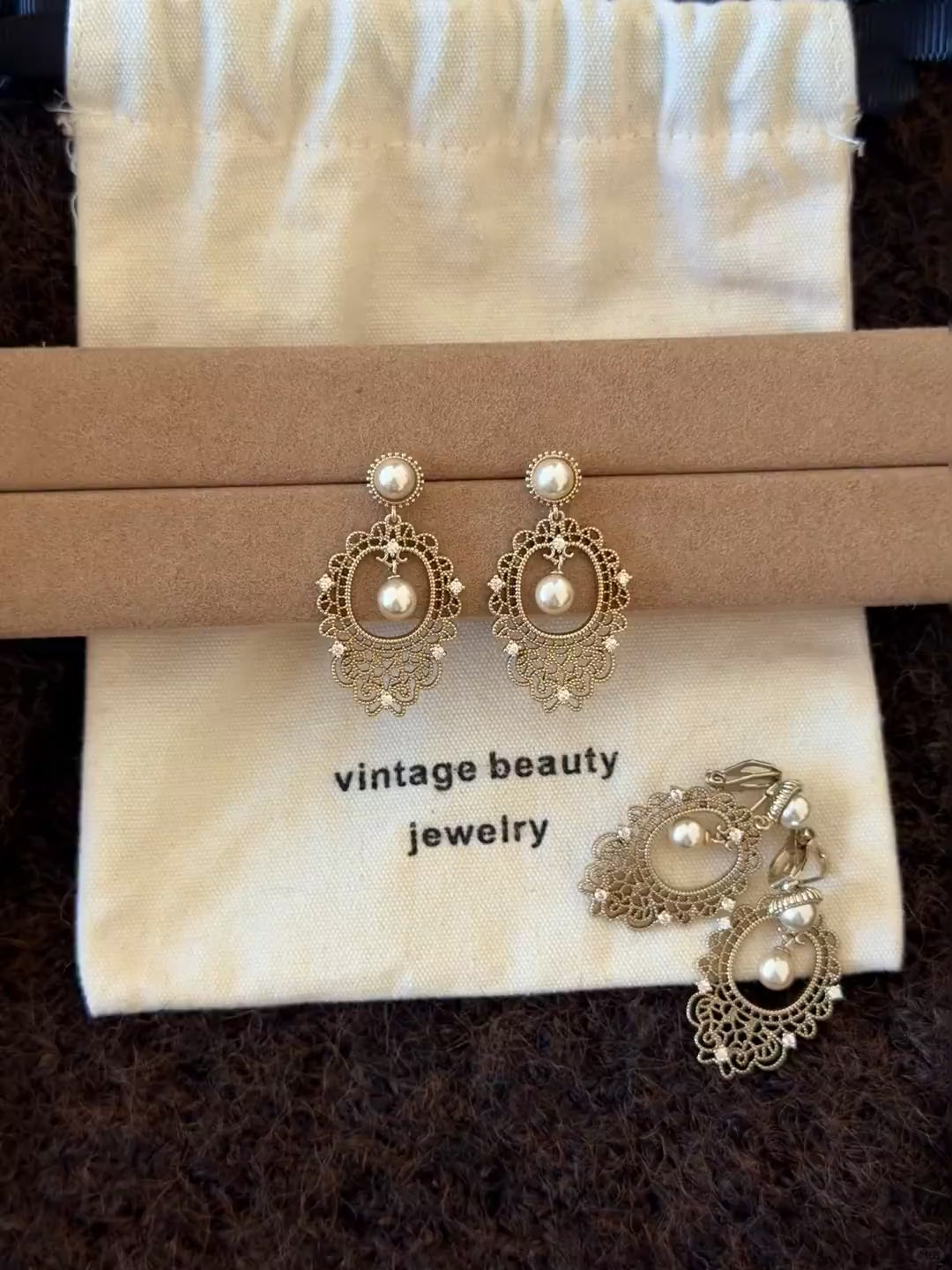 Video view of lace drop high-lustre freshwater pearl earrings styled for wedding guest looks