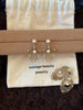 Video view of lace drop high-lustre freshwater pearl earrings styled for wedding guest looks