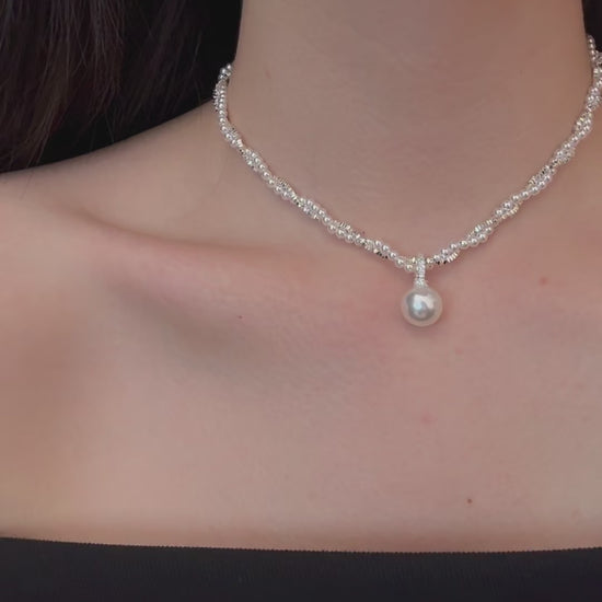Video view of layered silver-tone high-lustre freshwater pearl necklace styled for weddings