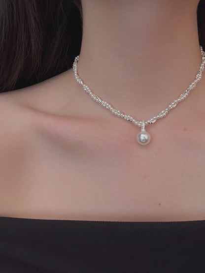 Video view of layered silver-tone high-lustre freshwater pearl necklace styled for weddings