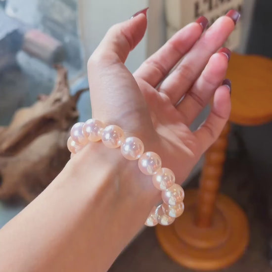Video view of blush strand high-lustre freshwater pearl bracelet styled for bridal styling