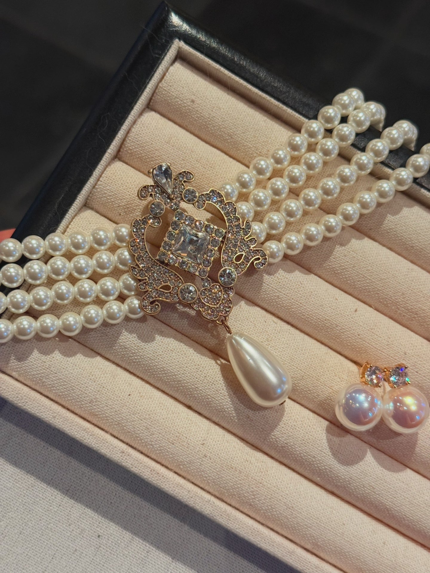 Video view of baroque drop high-lustre freshwater pearl earrings styled for wedding guest looks